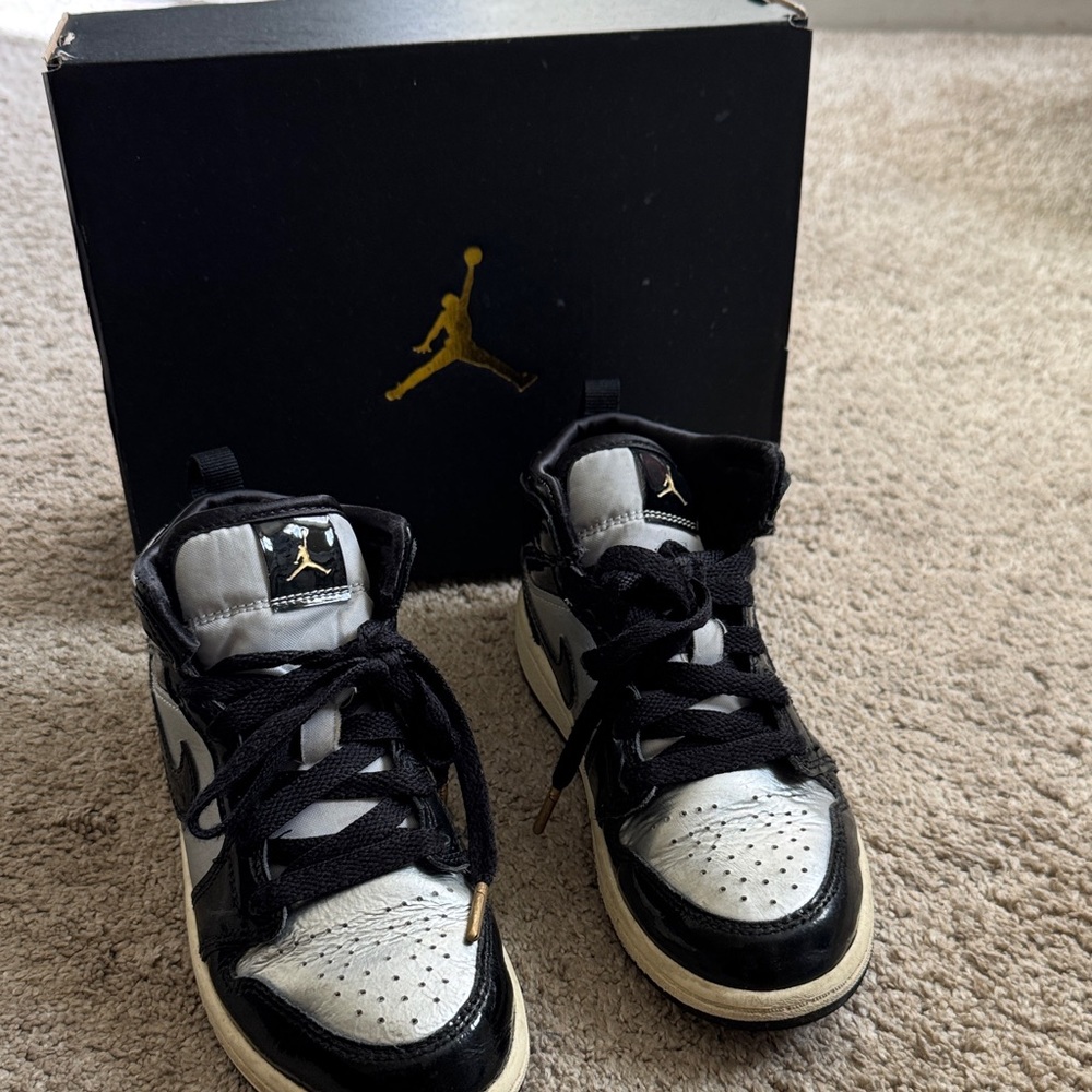 Kids Black and silver metallic Jordan’s